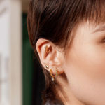 ANIA HAIE GOLD SPARKLE CROSS HOOP EARRINGS 